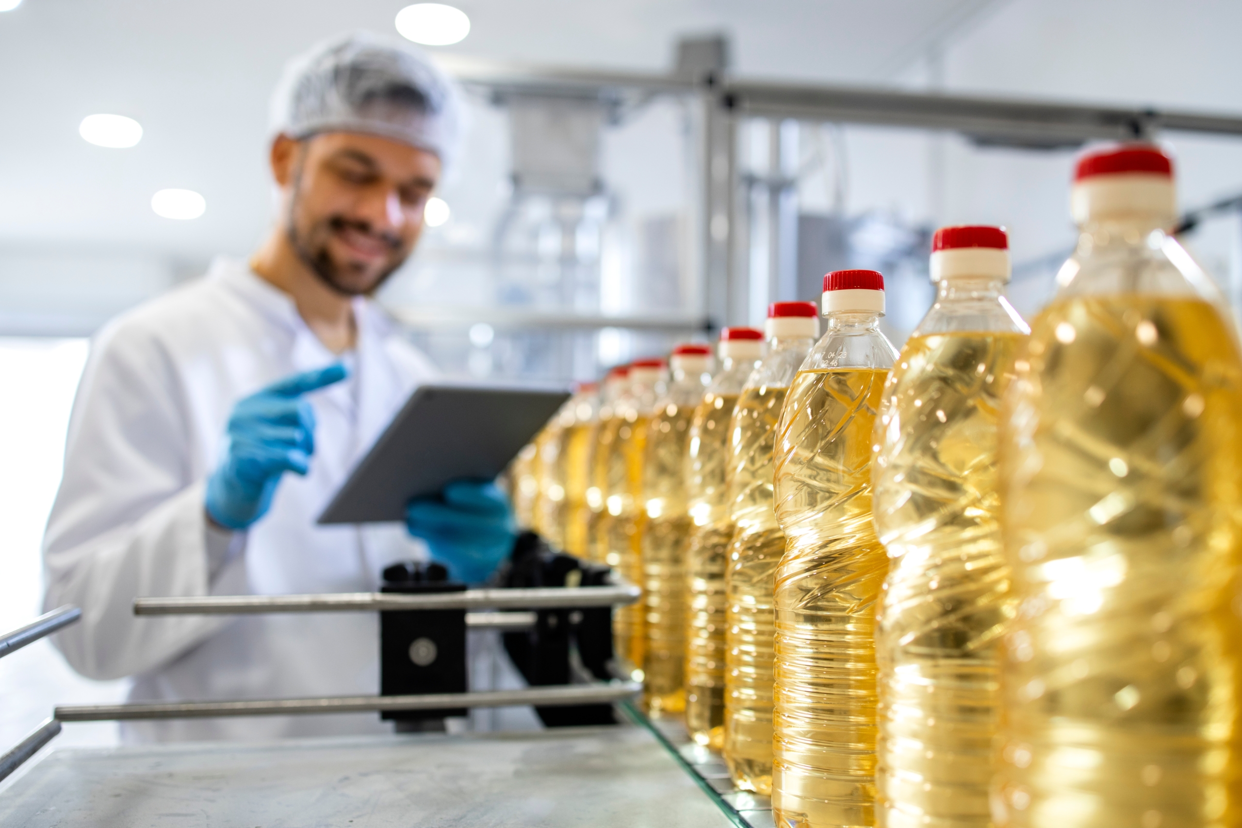 Close,Up,View,Of,Industrial,Vegetable,Oil,Production,And,Bottles