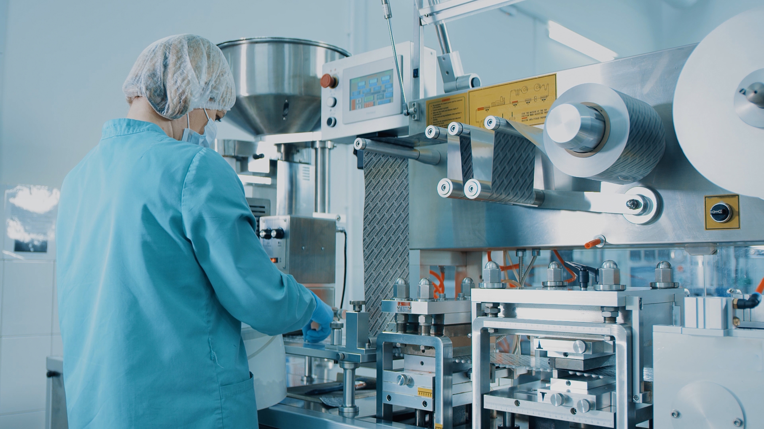 4k,Blister,Packing,Machine.,Woman,Works,At,The,Workplace.,Tablet